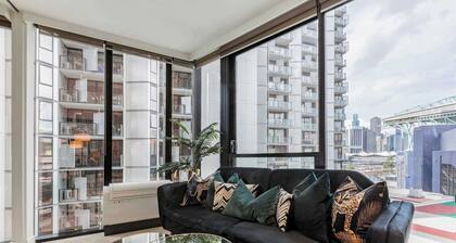Sleek glamour steps from Marvel Stadium and marina