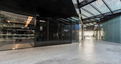 Sleek glamour steps from Marvel Stadium and marina