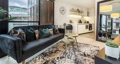 Sleek glamour steps from Marvel Stadium and marina
