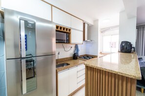 Fridge, microwave, cookware/dishes/utensils