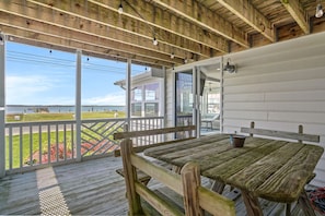 Outdoor dining - Touch of Grey | Waterfront w/ Private Dock, Screened Porch, Bikes, Fire Pit + Pets (Chincoteague Island)