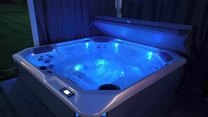 A hot tub with a digital control panel and LED lighting. - Arcade + Hot Tub Retreat Sauna Near WPAFB (Dayton)