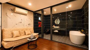 Suite with Sofa and Bathtub | Bathroom | Shower, rainfall showerhead, designer toiletries, hair dryer
