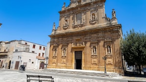 A historic building with intricate architectural details, a prominent entrance, and a statue on the facade. - Pagliara Il Morige 6 In The Countryside, Galatone, Italy (Galatone)