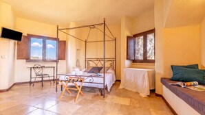 A room with a four-poster bed, a desk with a chair, a small table, and a sofa. - Pagliara Il Morige 5 In The Countryside, Galatone, Italy (Galatone)
