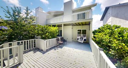 Two-story waterfront retreat with a furnished deck, washer/dryer, & AC