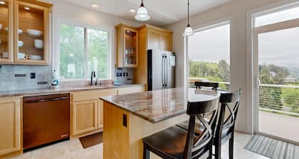 Ocean view home with heated floors, private hot tub, & multiple decks
