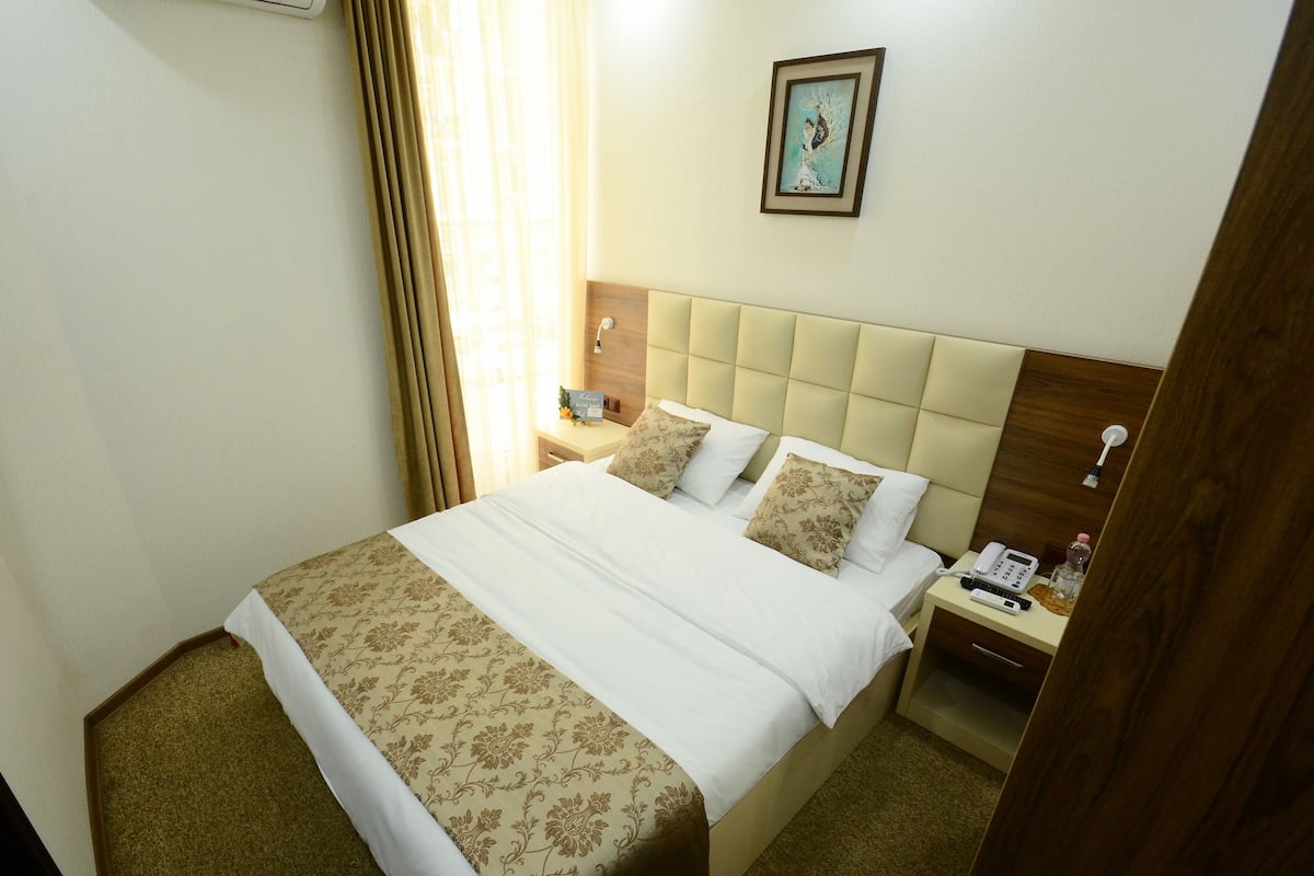 Economy Double Room Single Use | In-room safe, desk, laptop workspace, blackout drapes