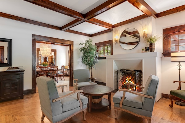 Sit back, relax, and enjoy the warmth of the fireplace while catching up with family and friends in cozy comfort in the living room.