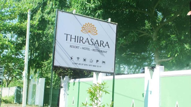 A sign for Thirasara Resort, Hotel, and Restaurant with contact information. - Thirasara Holiday Resort (Thissamaharama)