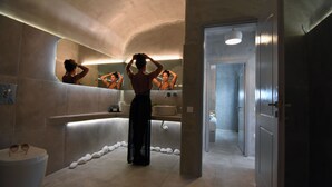 A modern bathroom with a large mirror, a bathtub, and a sink. - Design Superior Suite with Clear Sea View, Shared Infinity Pool, Gym, Pool Bar (C965+8J Mykonos, Greece)