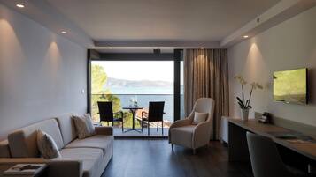 Deluxe Suite | Living area | 40-inch LCD TV with cable channels