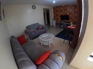 Comfort Apartment | Living area | 32-inch Smart TV with digital channels - Lux Suites Getare Homes Kisii (Kisii)