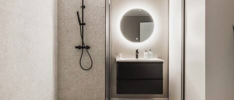 Shower, hair dryer, towels, soap
