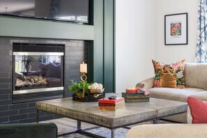 TV, fireplace, books