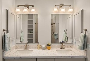 Shower, hair dryer, towels, shampoo