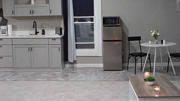 Fridge, coffee/tea maker, toaster, cookware/dishes/utensils
