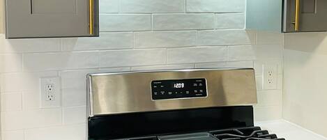 Fridge, coffee/tea maker, toaster, cookware/dishes/utensils