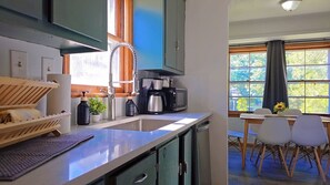 Fridge, coffee/tea maker, toaster, cookware/dishes/utensils