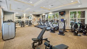 A gym with treadmills, elliptical machines, and weightlifting equipment. - This townhouse is a 5 bedroom(s), 4.5 bathrooms, located in Davenport, FL. (Davenport)
