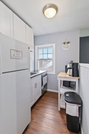 Fridge, coffee/tea maker, toaster, cookware/dishes/utensils