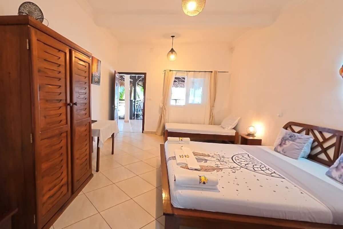 Comfort Triple Room, Partial Sea View | In-room safe, laptop workspace, blackout drapes, free WiFi