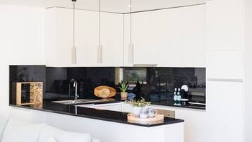 Coffee/tea maker, fridge, microwave, oven