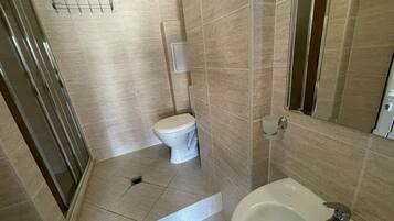 Shower, towels, soap, toilet paper
