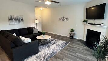 Family House, 4 Bedrooms, Patio, Courtyard View | Living room | 60-inch Smart TV with digital channels, fireplace, Netflix