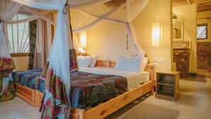 A bedroom with a wooden bed, a canopy, and a nightstand. - RUAHA HILLTOP LODGE (Idodi)