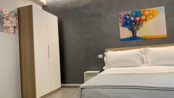 1 bedroom, desk, iron/ironing board, travel crib