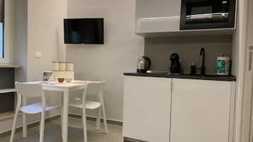 Fridge, microwave, stovetop, coffee/tea maker