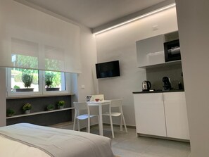 1 bedroom, desk, iron/ironing board, travel cot