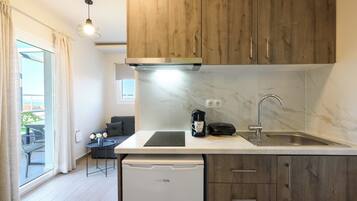 Fridge, stovetop, espresso maker, coffee/tea maker