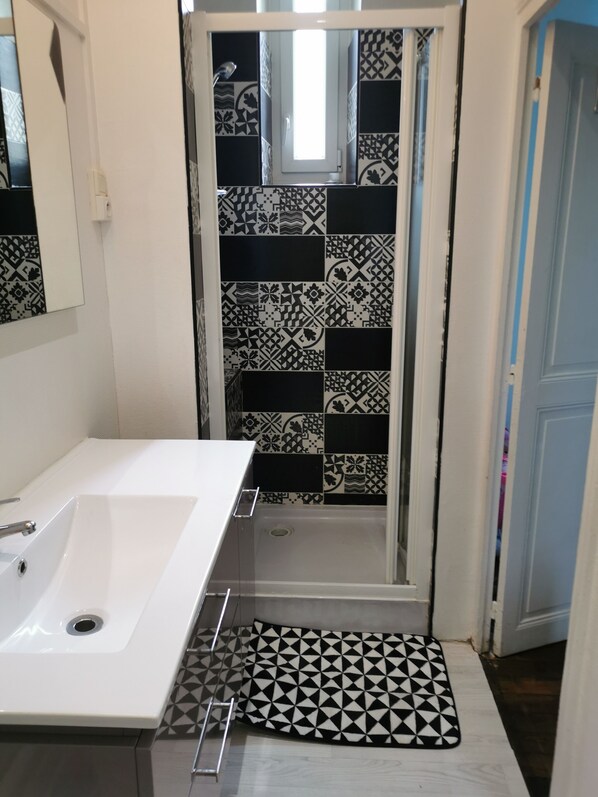 Shower, hair dryer, towels, soap