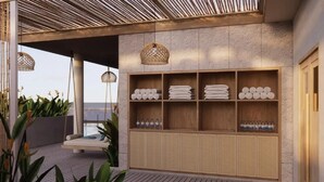A modern outdoor seating area with a wooden bench and hanging wicker lamps. - Sunrise By Mandala Mui Ne (Mui Ne)