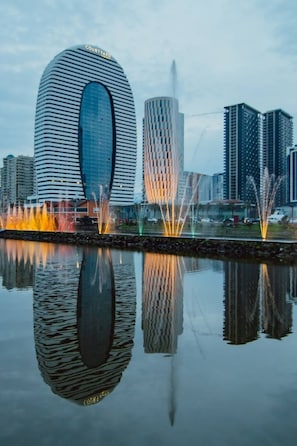 A modern building with a curved facade and a sign that reads "COURTYARD."