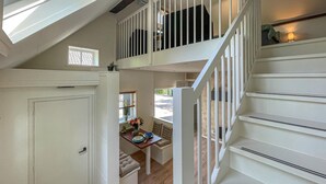 A staircase with white railings leading to a second-floor balcony. - Cozy home in Noordscheschut with WiFi (Noordscheschut)