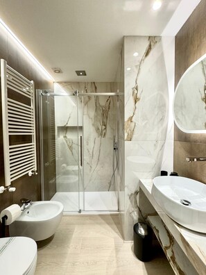 Hair dryer, bidet, towels, soap