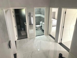 Shower, hair dryer, towels, toilet paper