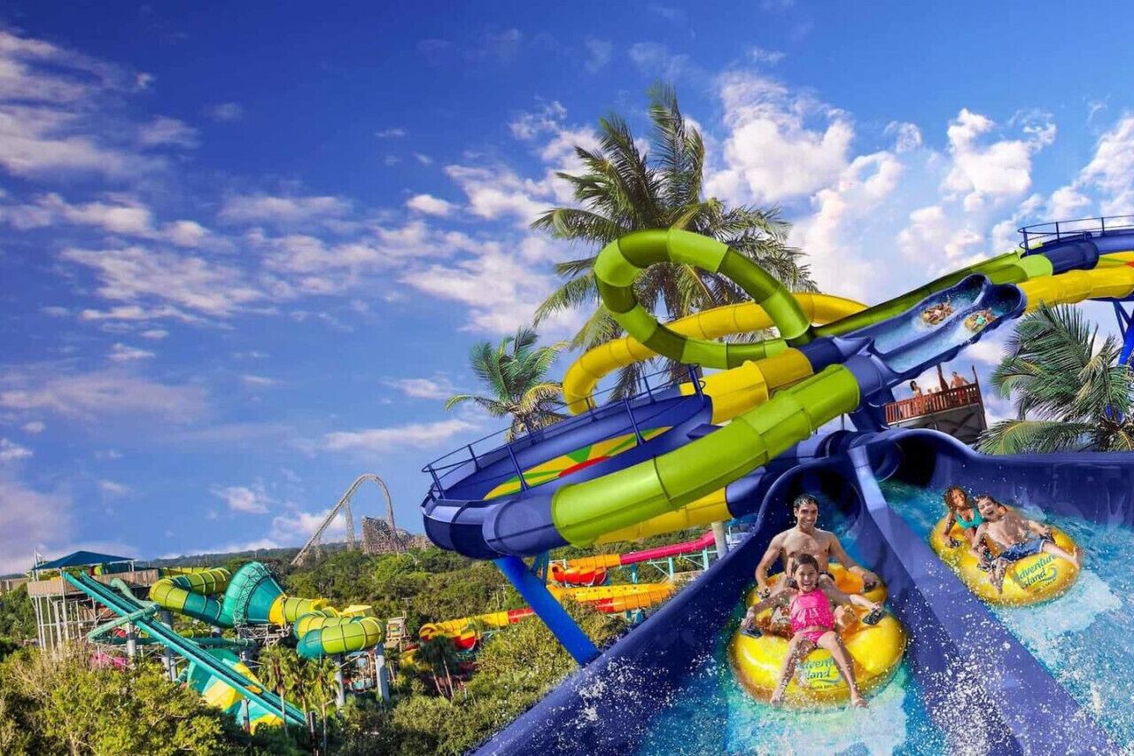A water park with a large water slide and multiple smaller slides.