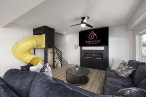 Smart TV, fireplace, video games, foosball