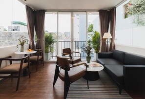 Studio, Balcony | Minibar, in-room safe, desk, laptop workspace - Nexus House Cay Diep - Near Independence Palace (Ho Chi Minh City)