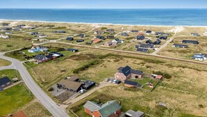 An aerial view of a coastal residential area with houses, roads, and a beach. - "Hilppa" - 400m from the sea by Interhome (Harboøre)