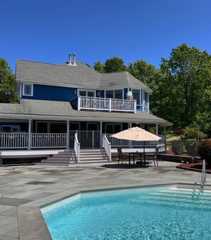 A two-story house with a swimming pool, a covered patio, and a fenced deck. - Gateway to the Gunks: Winery Walks & Rock Walls (Gardiner)
