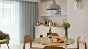 A modern kitchen with a dining area.