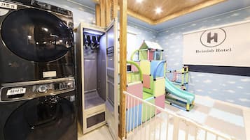 Enjoy a family-friendly stay with a play area featuring a slide and play structures, a washer and dryer, and a large mirror.