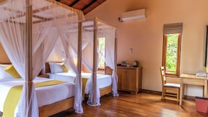 A room with a four-poster bed, a wooden desk, and a chair. - Sigiriya Forest Edge By Marino Leisure (Avudangawa)