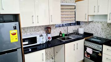 Apartment | Private kitchen | Dining tables