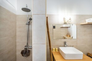 Shower, hair dryer, towels, soap